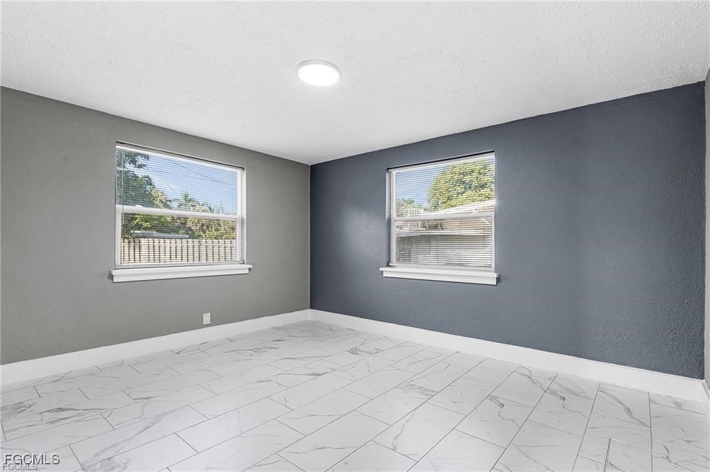 4472 East Riverside Drive Fort Myers, FL 33905 - Photo 7 of 17 a view of an empty room with window