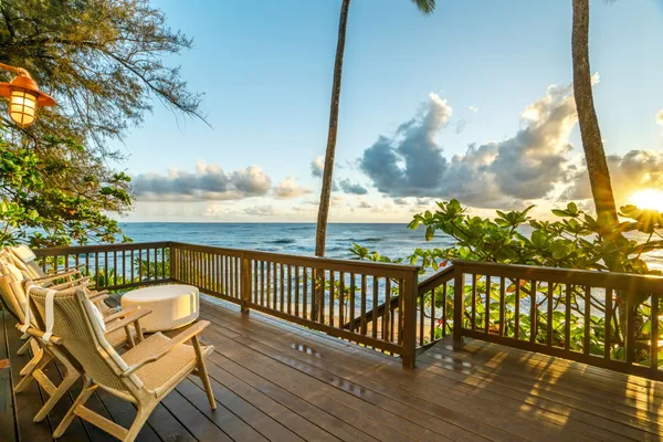 a view of a balcony with wooden floor