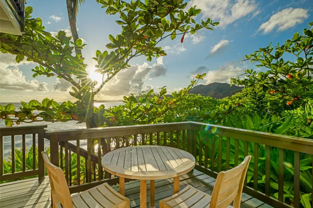 a view of balcony with wooden floor and outdoor seating