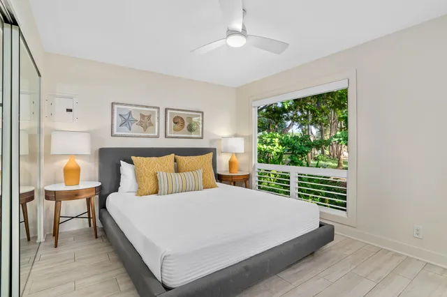 a bedroom with a large bed and a window
