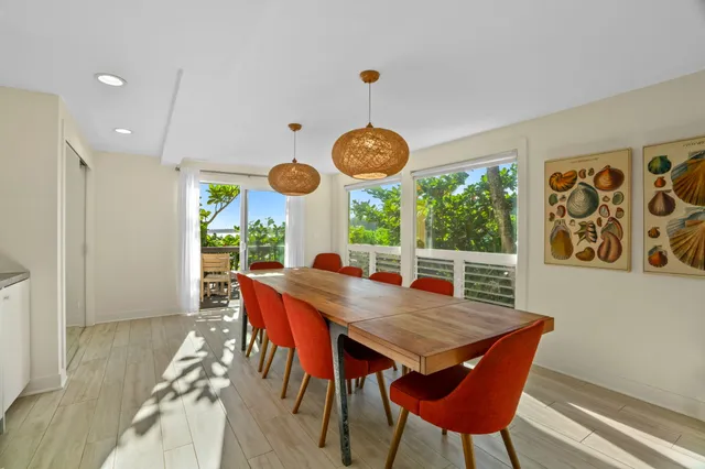 a view of a dining table and chairs in the room