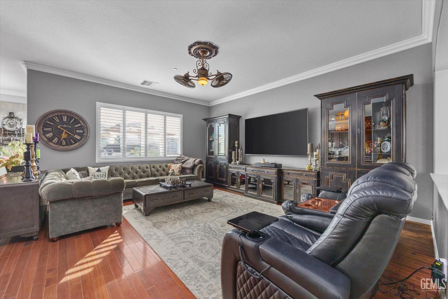 Undisclosed Address Bakersfield, CA 93314 - Photo 17 of 56 a living room with furniture and a flat screen tv