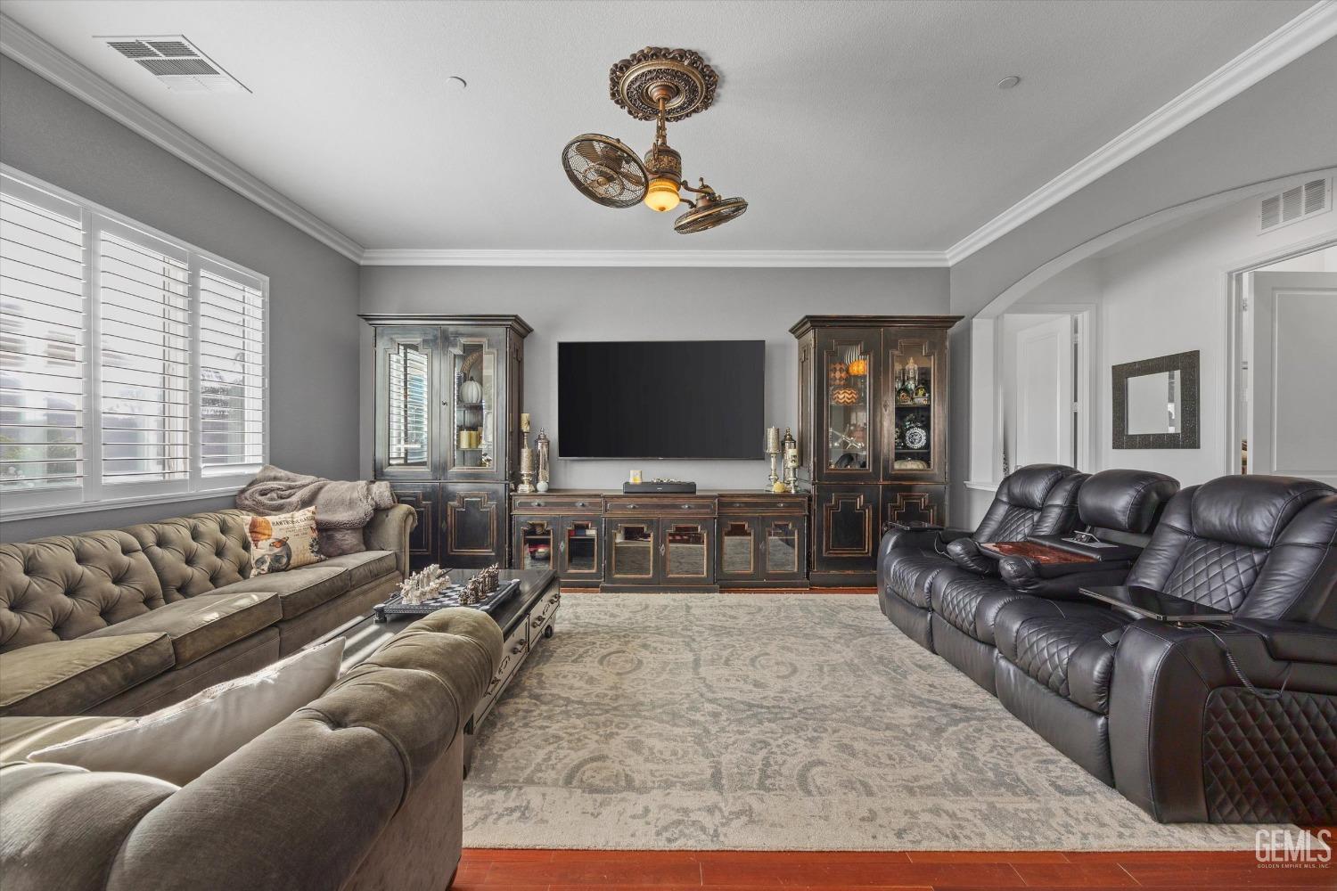 Undisclosed Address Bakersfield, CA 93314 - Photo 18 of 56 a living room with furniture and a flat screen tv