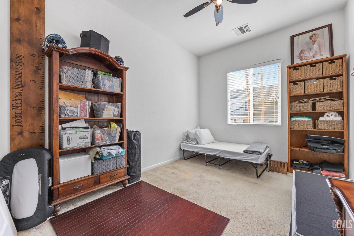 Undisclosed Address Bakersfield, CA 93314 - Photo 37 of 56 a living room with furniture a rug and a window