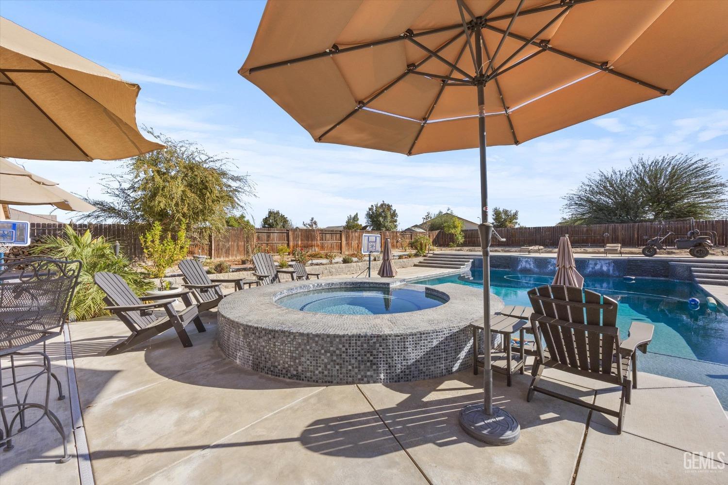 Undisclosed Address Bakersfield, CA 93314 - Photo 43 of 56 a view of a swimming pool with a patio