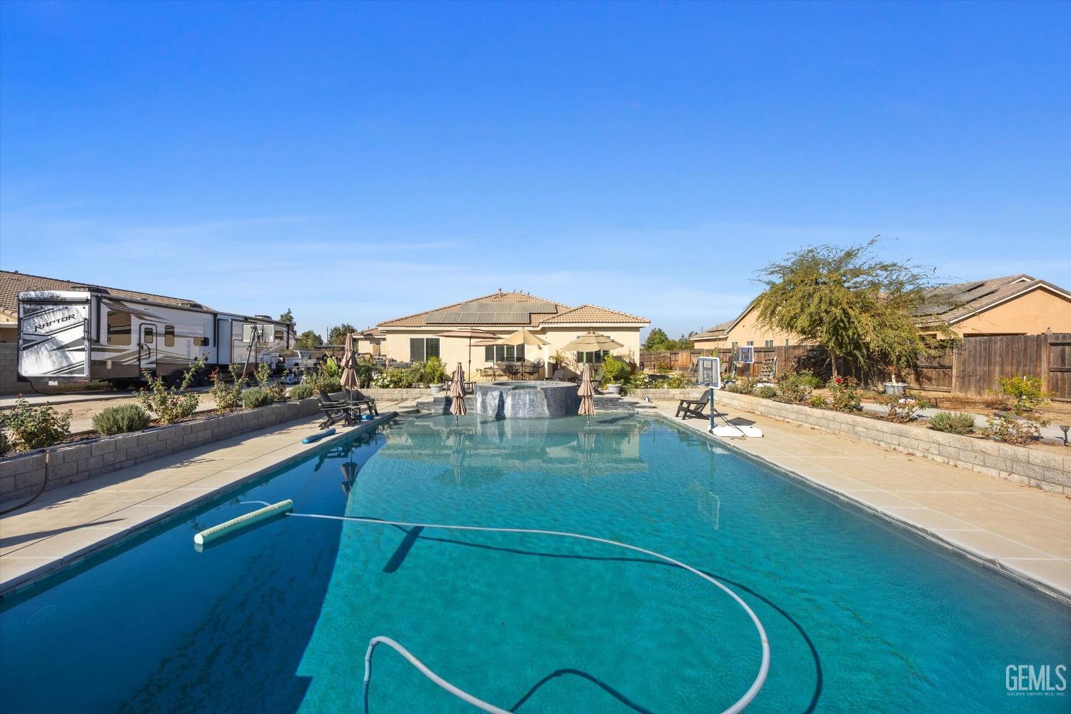 Undisclosed Address Bakersfield, CA 93314 - Photo 47 of 56 a view of a swimming pool and a terrace