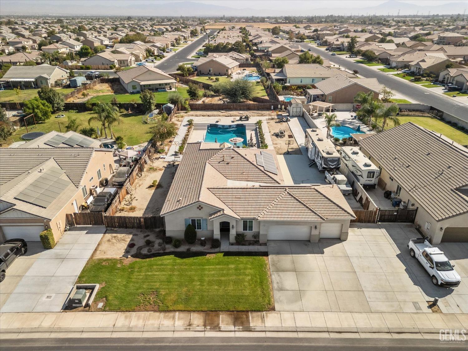 Undisclosed Address Bakersfield, CA 93314 - Photo 5 of 56 an aerial view of a house with a yard