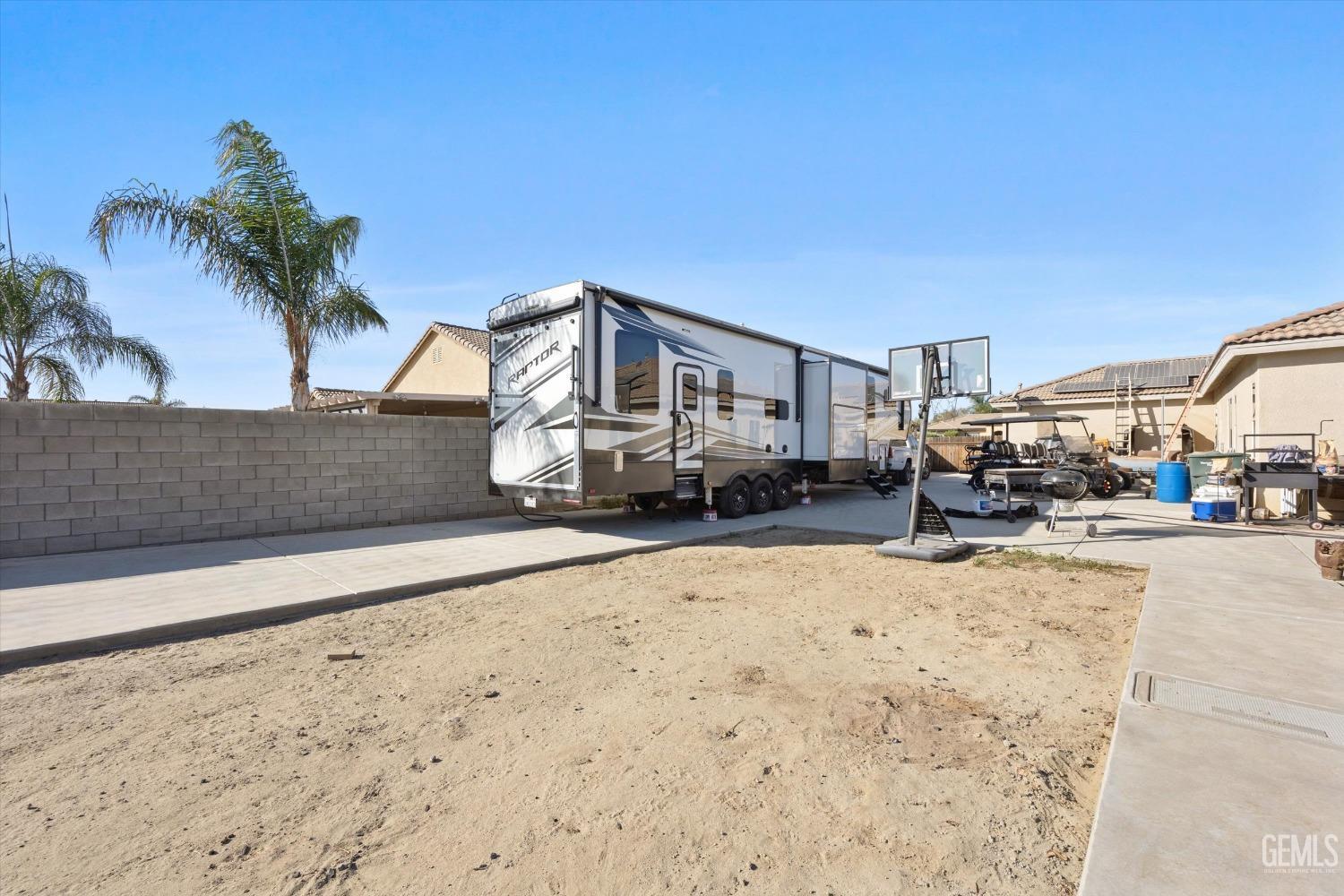 Undisclosed Address Bakersfield, CA 93314 - Photo 51 of 56 a view of a car park in front of a house