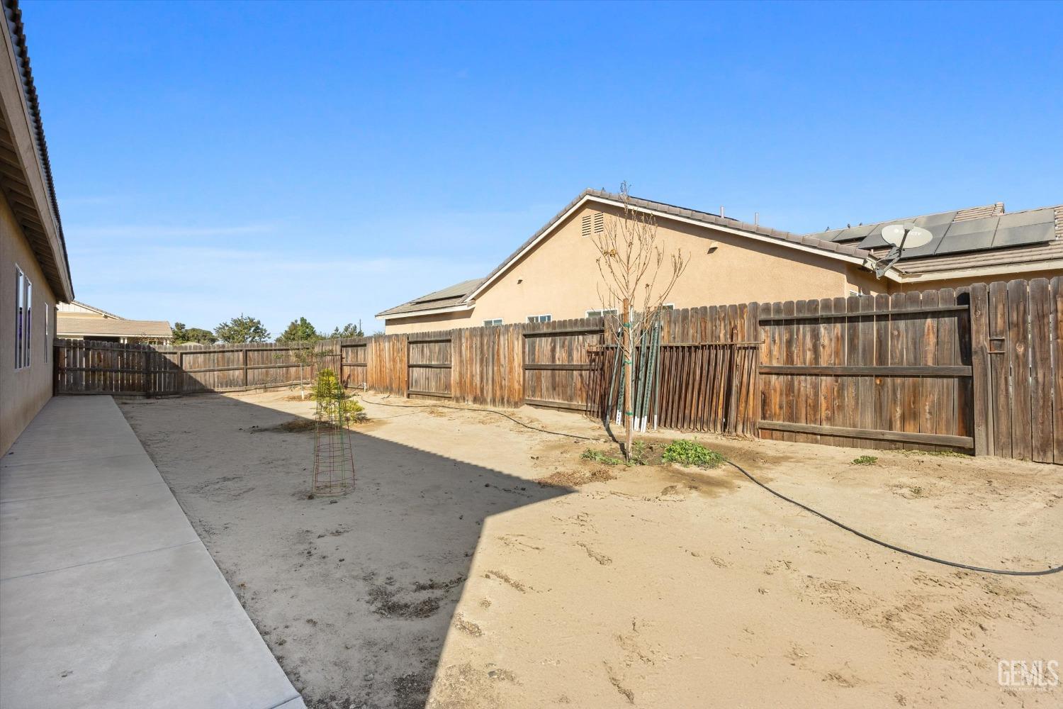 Undisclosed Address Bakersfield, CA 93314 - Photo 52 of 56 a view of a house with a swimming pool
