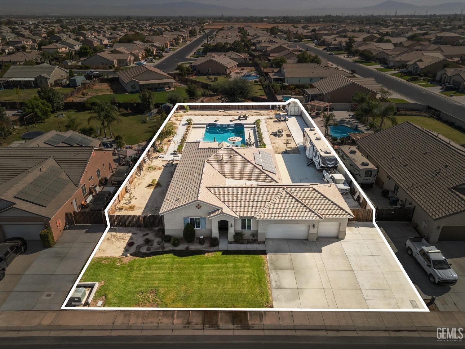 Undisclosed Address Bakersfield, CA 93314 - Photo 53 of 56 an aerial view of a house with a swimming pool