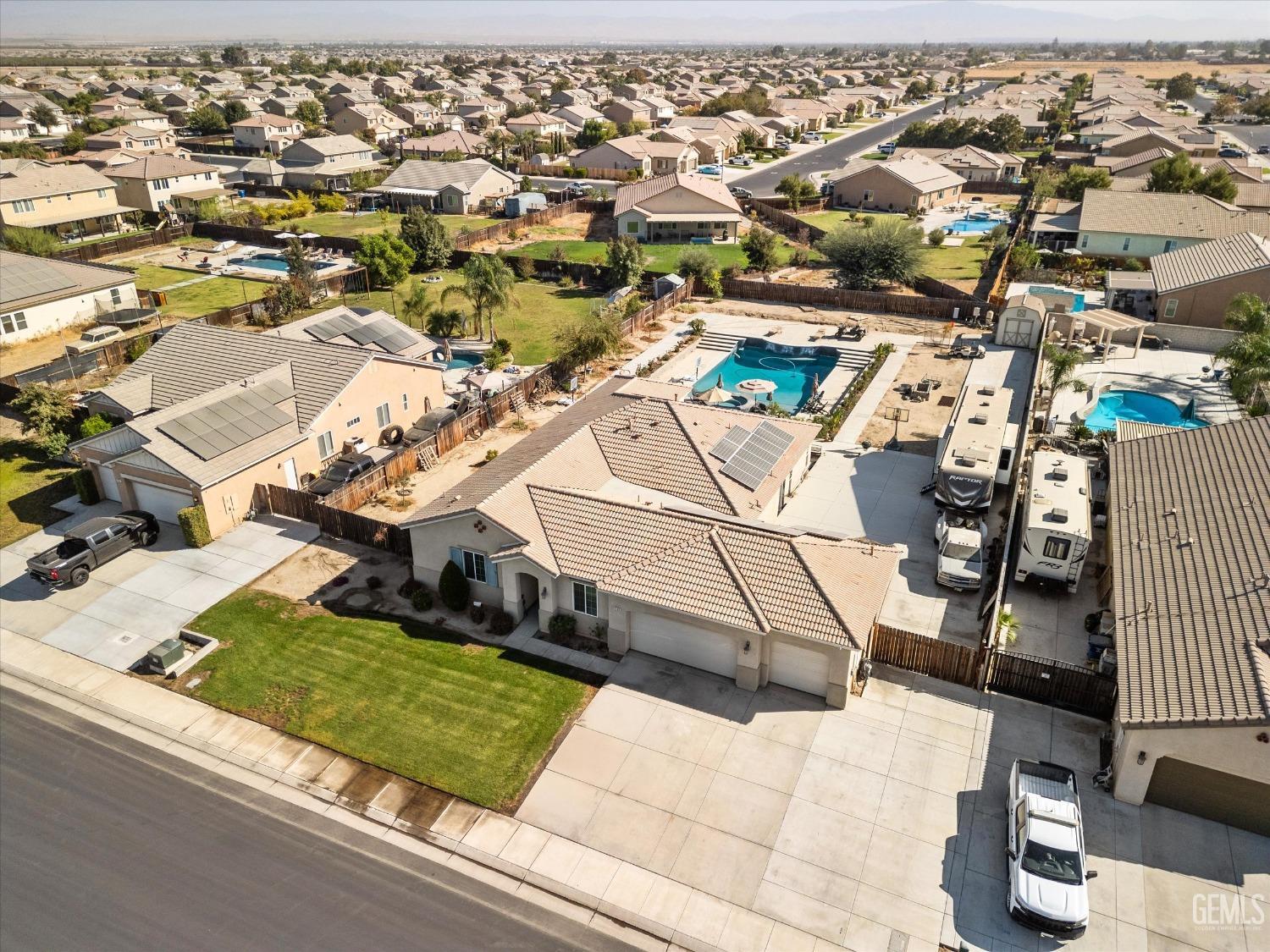 Undisclosed Address Bakersfield, CA 93314 - Photo 6 of 56 an aerial view of residential houses with outdoor space