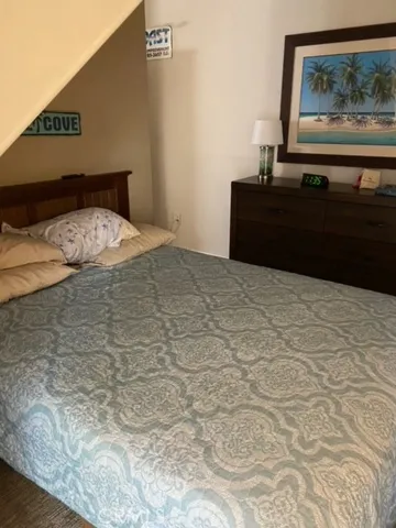 a white toilet sitting next to a sink