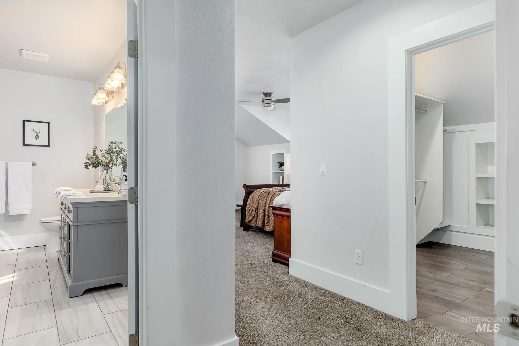 2912 East Bonfire Lane Eagle, ID 83616 - Photo 27 of 50 Corridor featuring baseboards and light colored carpet
