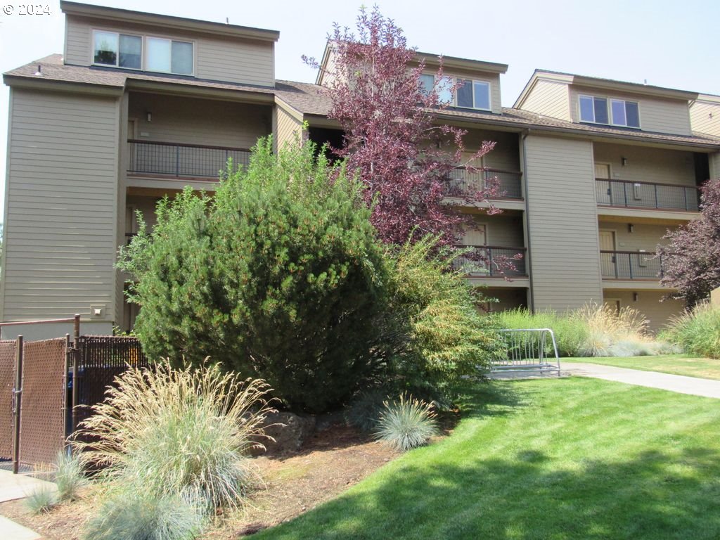 18575 Southwest Century Drive, Unit 1721&22 Bend, OR 97702 - Photo 1 of 40 a view of a house with a yard