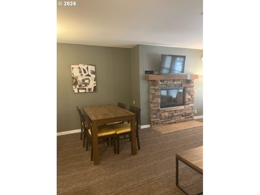 18575 Southwest Century Drive, Unit 1721&22 Bend, OR 97702 - Photo 13 of 40 a living room with furniture and a table