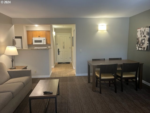 18575 Southwest Century Drive, Unit 1721&22 Bend, OR 97702 - Photo 22 of 40 a living room with furniture and a wooden floor