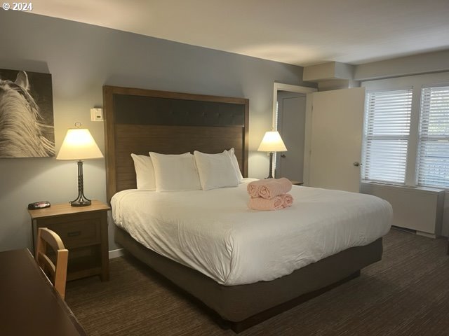 18575 Southwest Century Drive, Unit 1721&22 Bend, OR 97702 - Photo 30 of 40 a bedroom with a bed and a lamp