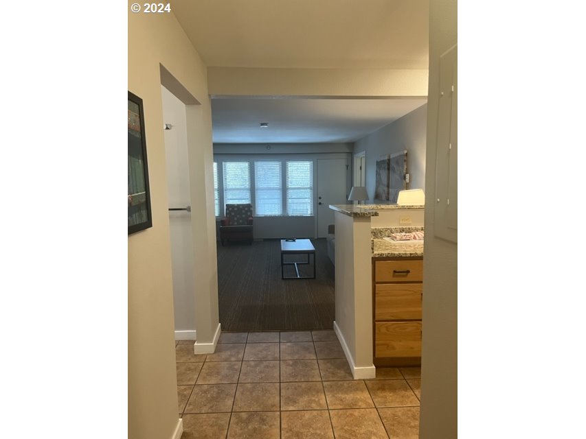 18575 Southwest Century Drive, Unit 1721&22 Bend, OR 97702 - Photo 5 of 40 a kitchen with a refrigerator and washer