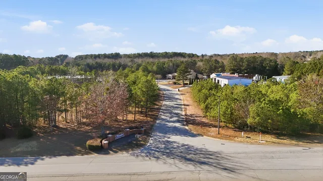 a aerial view of a house with a yard and garden