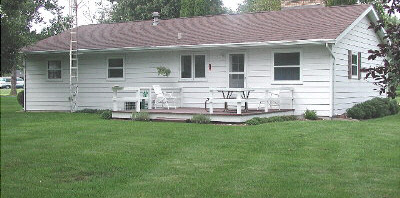 11873 Tresemer Road Roscoe, IL 61073 - Photo 6 of 6 a view of house with backyard and sitting area