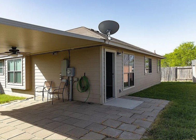 7703 Redstone Manor Converse, TX 78109 - Photo 18 of 28 Rear view of property with a patio and a ceiling fan