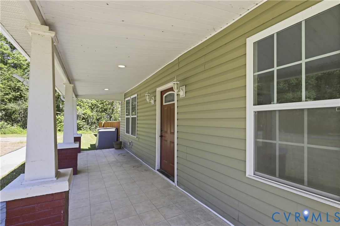 36 Columbia Road Cartersville, VA 23027 - Photo 5 of 35 Expansive covered porch featuring tiled flooring,