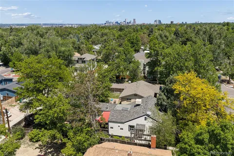 an aerial view of residential house with outdoor space and swimming pool