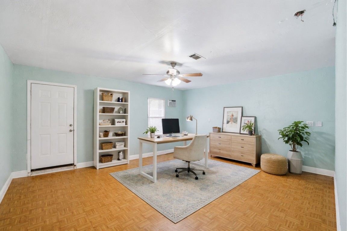 10922 Ivyridge Road Houston, TX 77043 - Photo 7 of 17 a living room with furniture and a chandelier