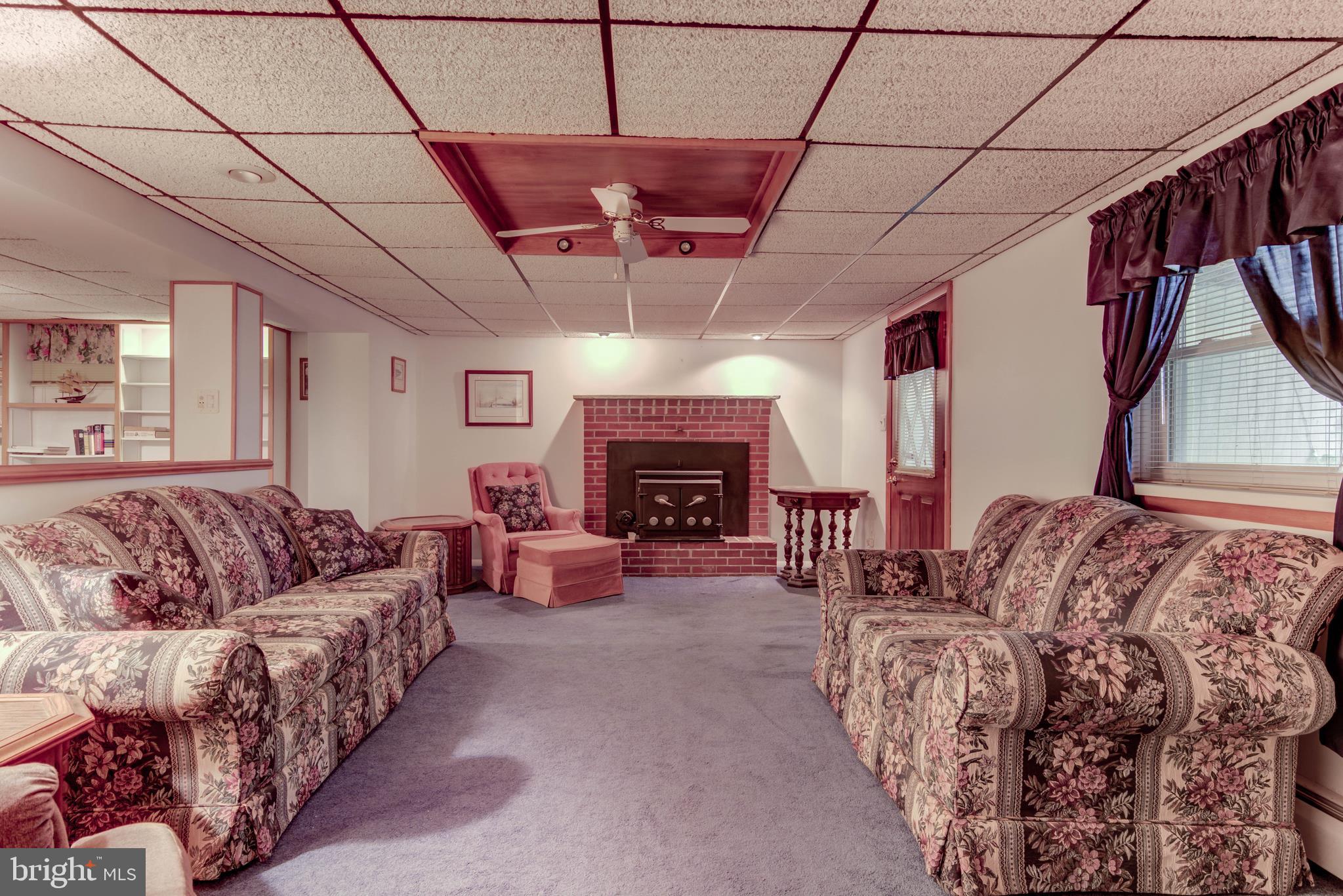 381 Pusey Mill Road Cochranville, PA 19330 - Photo 25 of 28 Lower Level Family Room with fireplace