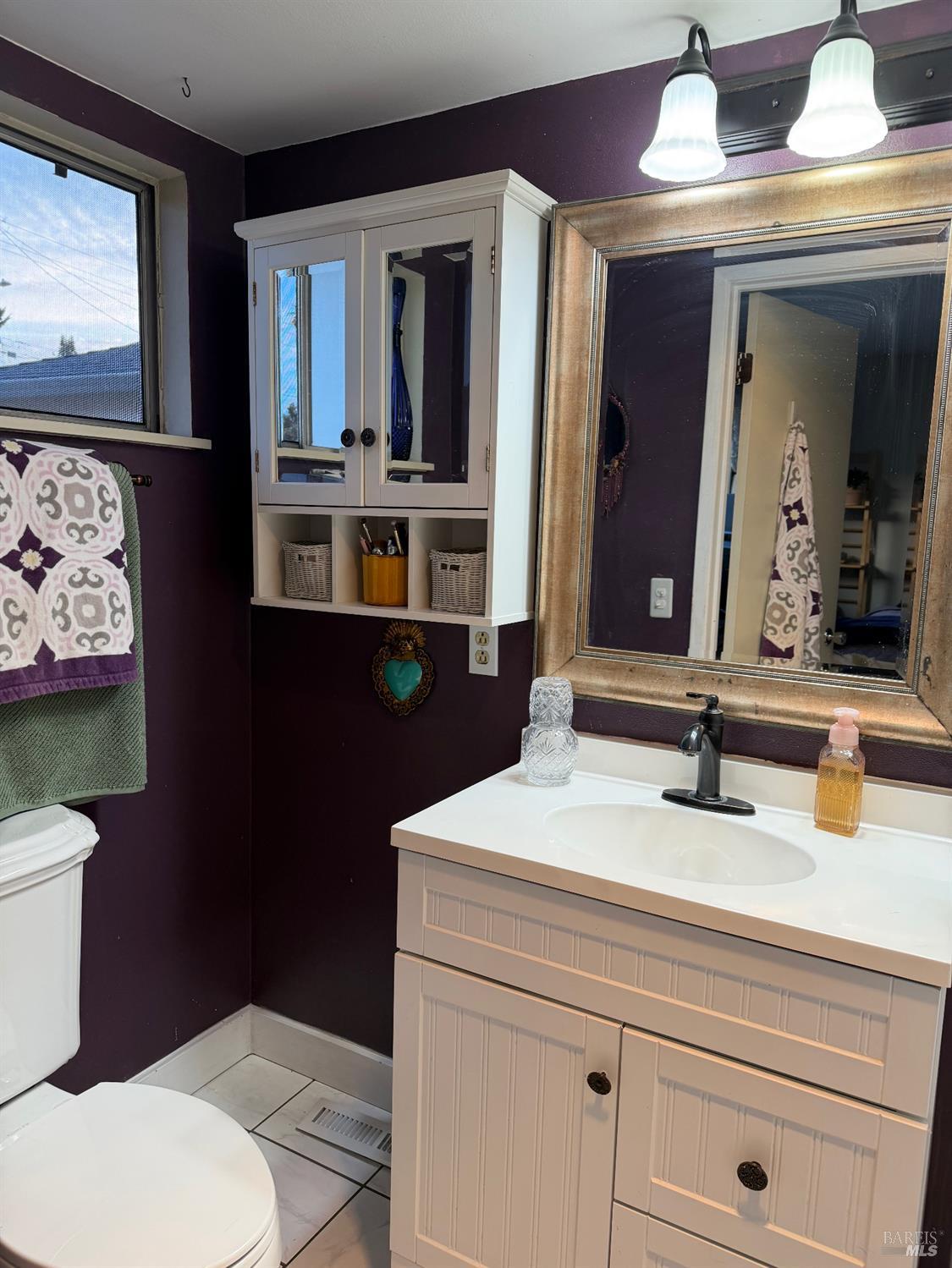 611 Willrush Street Santa Rosa, CA 95401 - Photo 11 of 19 a bathroom with a sink and a toilet