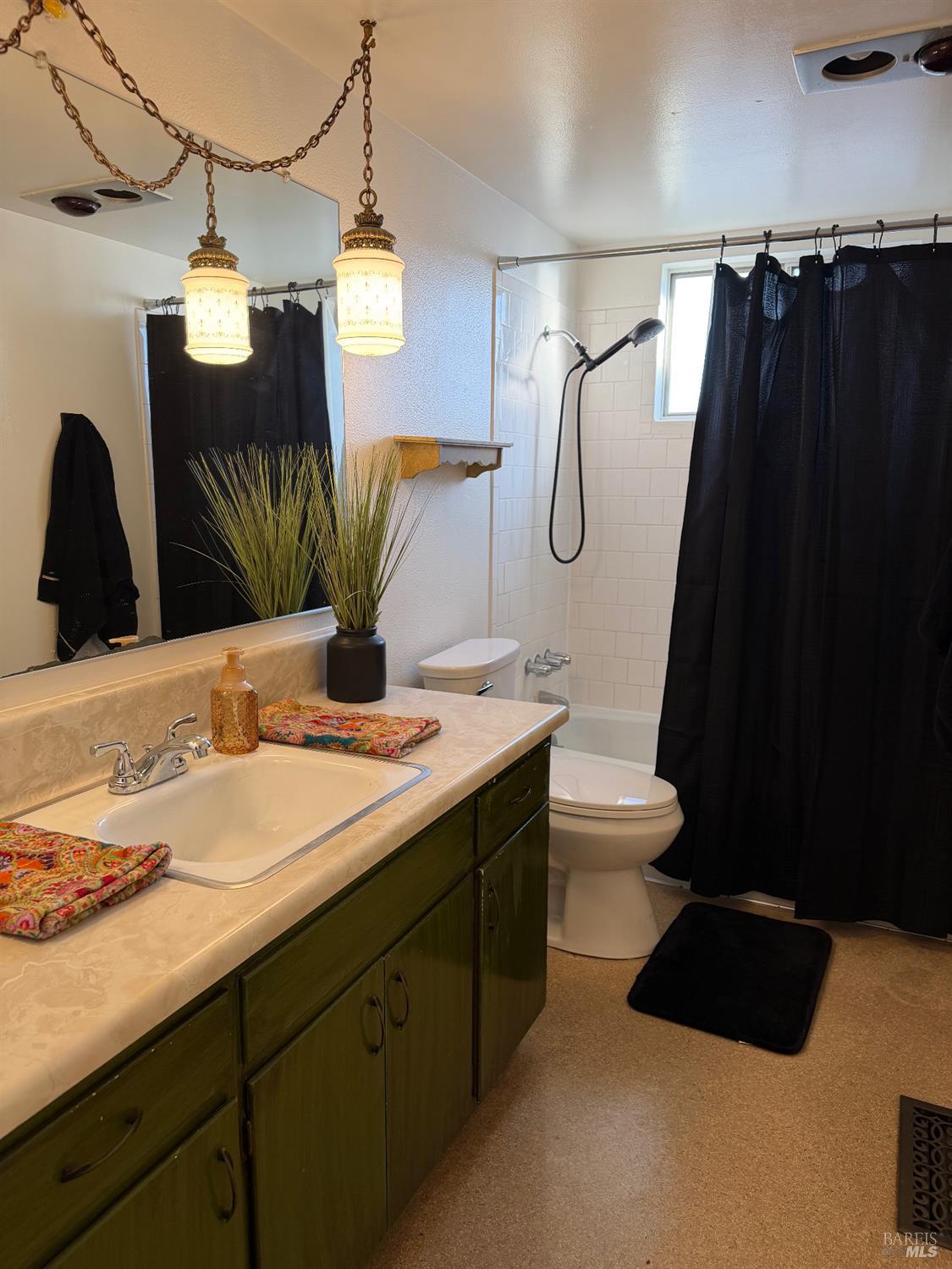 611 Willrush Street Santa Rosa, CA 95401 - Photo 13 of 19 a bathroom with a double vanity sink and a mirror