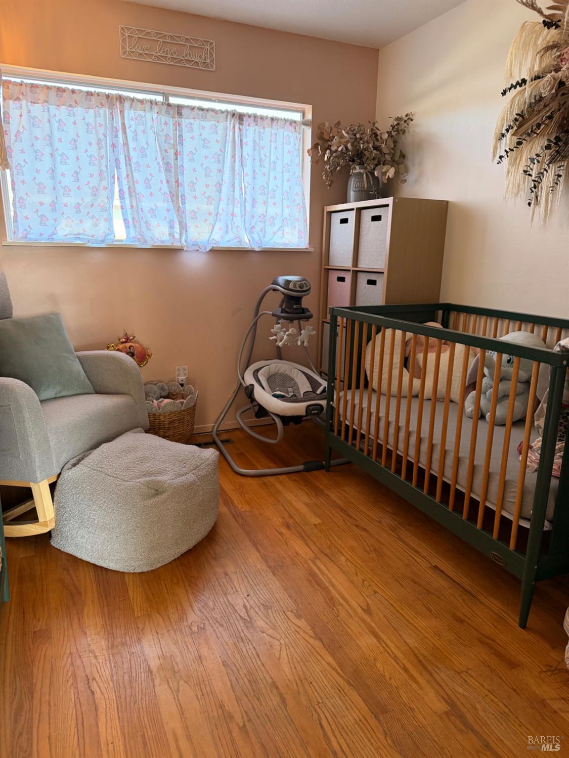 611 Willrush Street Santa Rosa, CA 95401 - Photo 15 of 19 a bedroom with furniture and wooden floor