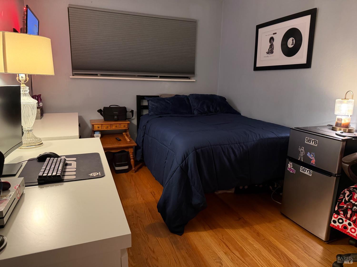 611 Willrush Street Santa Rosa, CA 95401 - Photo 16 of 19 a living room with a bed furniture and a flat screen tv