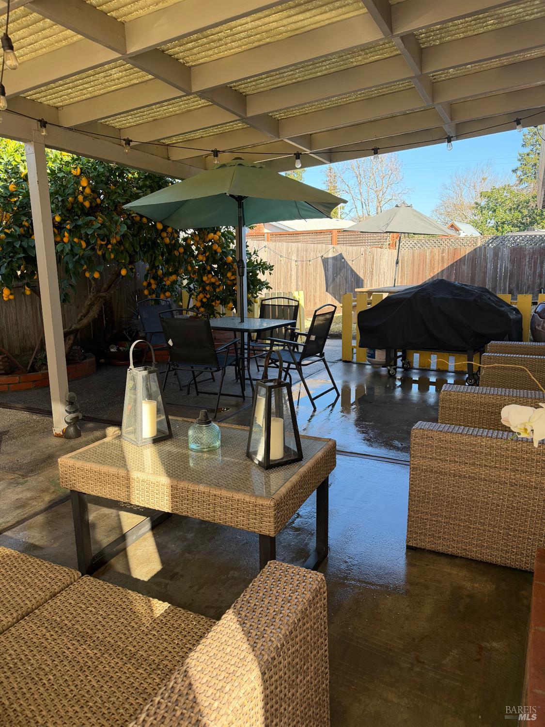 611 Willrush Street Santa Rosa, CA 95401 - Photo 18 of 19 a view of a patio with table and chairs potted plants with wooden floor