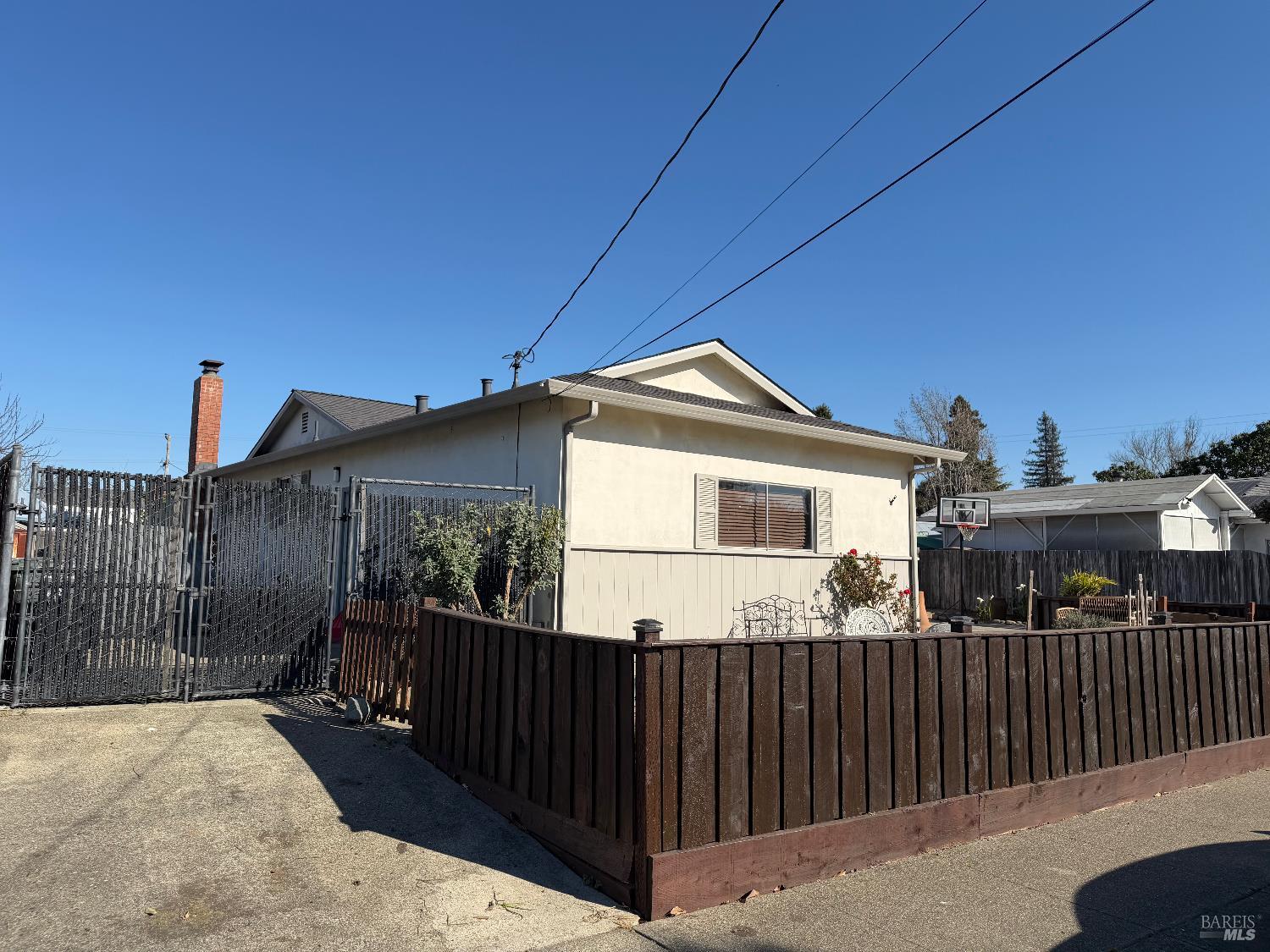 611 Willrush Street Santa Rosa, CA 95401 - Photo 3 of 19 a front view of house yard with wooden fence