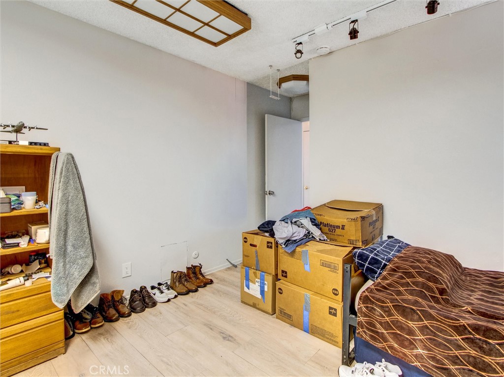 10552 Royal Oak Way Stanton, CA 90680 - Photo 18 of 21 a bed room with a bed and a mirror