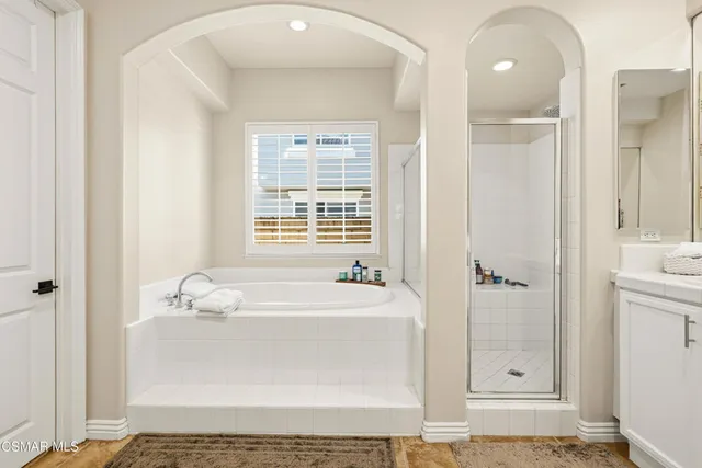 a bathroom with a bathtub and a sink
