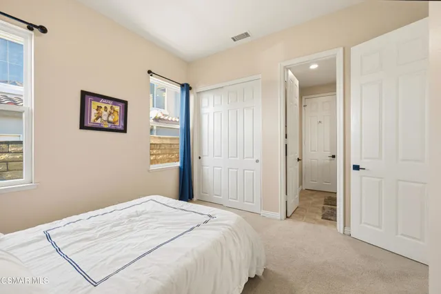 a bedroom with a bed and a view of bathroom