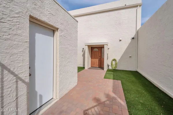 a kitchen with refrigerator a sink and cabinets