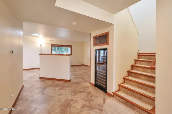 a bed room with a bed and a large window
