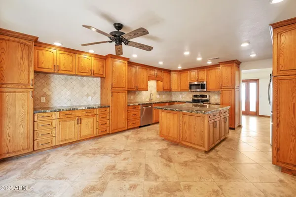 a spacious bathroom with a double vanity sink mirror and shower