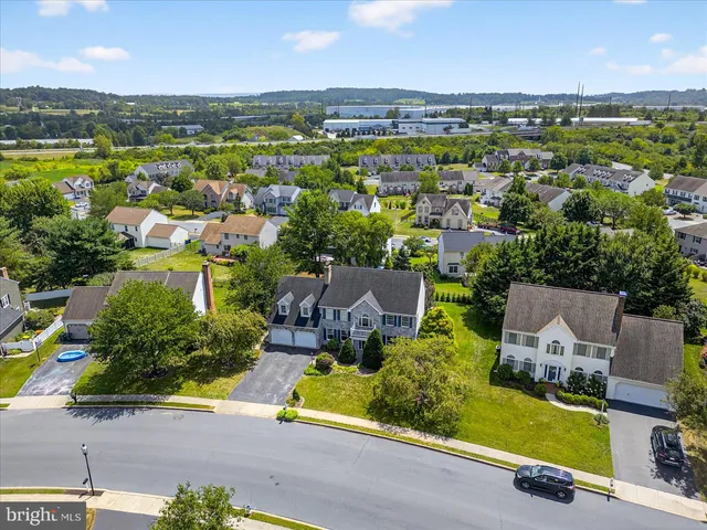 an aerial view of a house with a garden