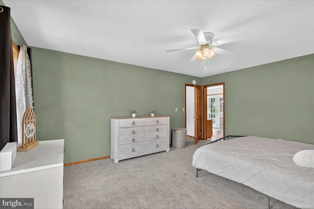 a bedroom with furniture and wooden floor