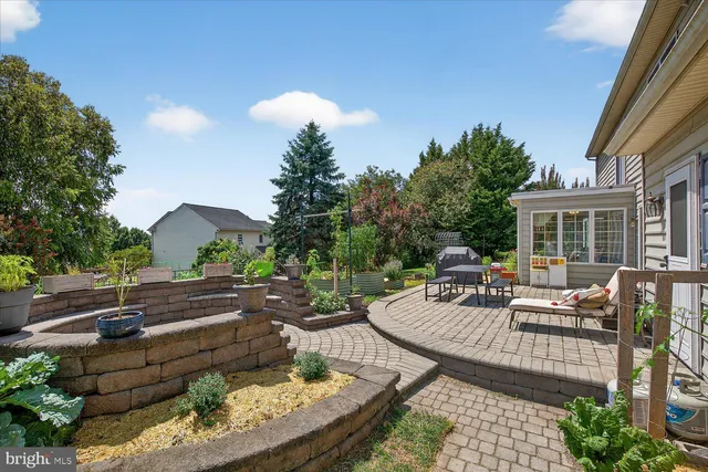 an aerial view of a house with yard