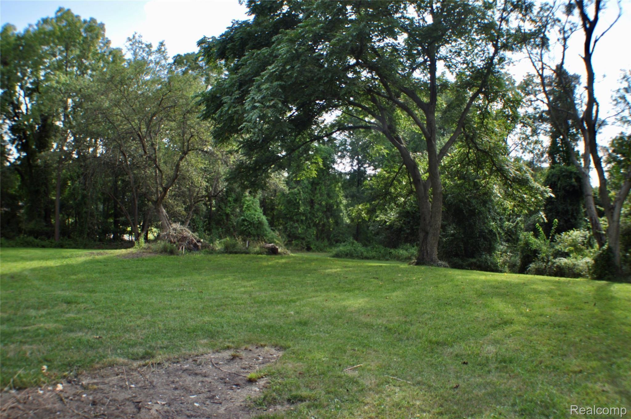1245 East Buno Road Milford, MI 48381 - Photo 29 of 30 Yard with the firepit area.