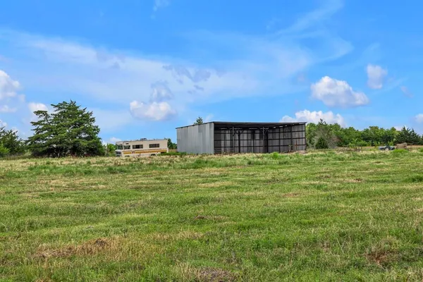 a backyard of a house with lots of green space