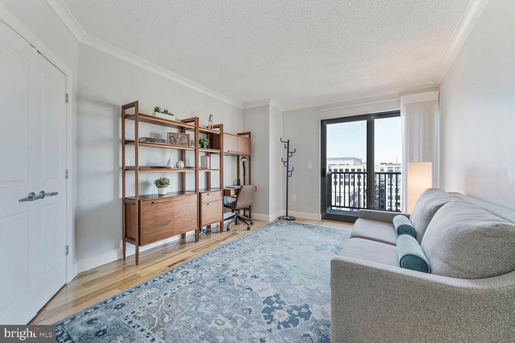 777 7th Street Northwest, Unit 1124 Washington, DC 20001 - Photo 12 of 16 a living room with furniture hardwood floor and a large window