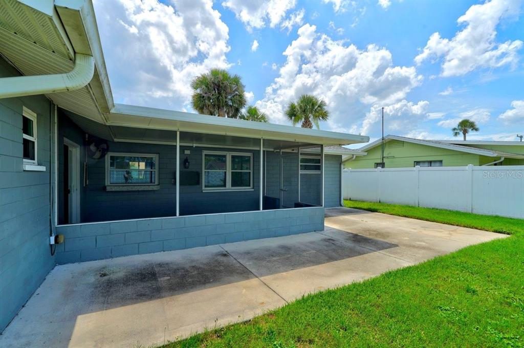 1309 Suwanee Road Daytona Beach, FL 32114 - Photo 26 of 33 a front view of a house with a garden and yard