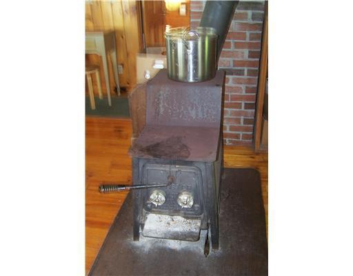 389 Manhanock Pond Road Sangerville, ME 04479 - Photo 16 of 20 Other. Woodstove in livingroom that...