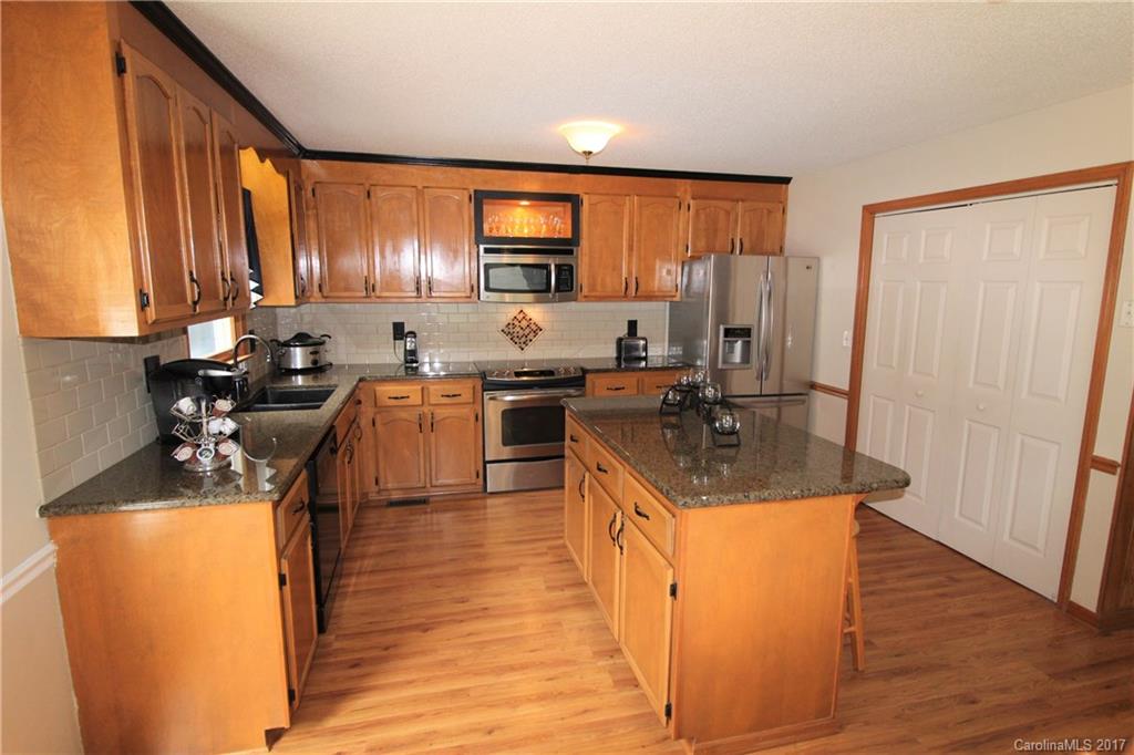 827 Brian Road, Unit 5 Clover, SC 29710 - Photo 2 of 21 a kitchen with stainless steel appliances granite countertop a sink a stove and a refrigerator